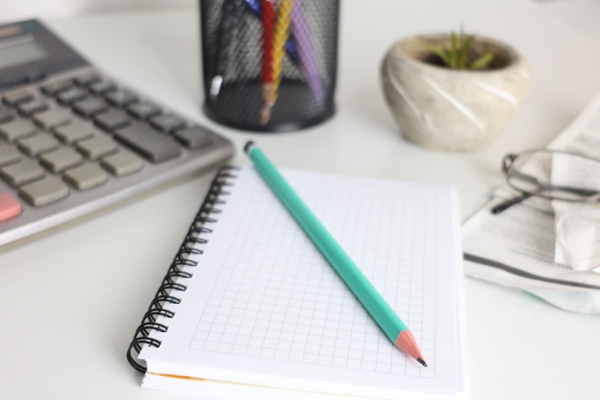 Notebook and calculator on a desk